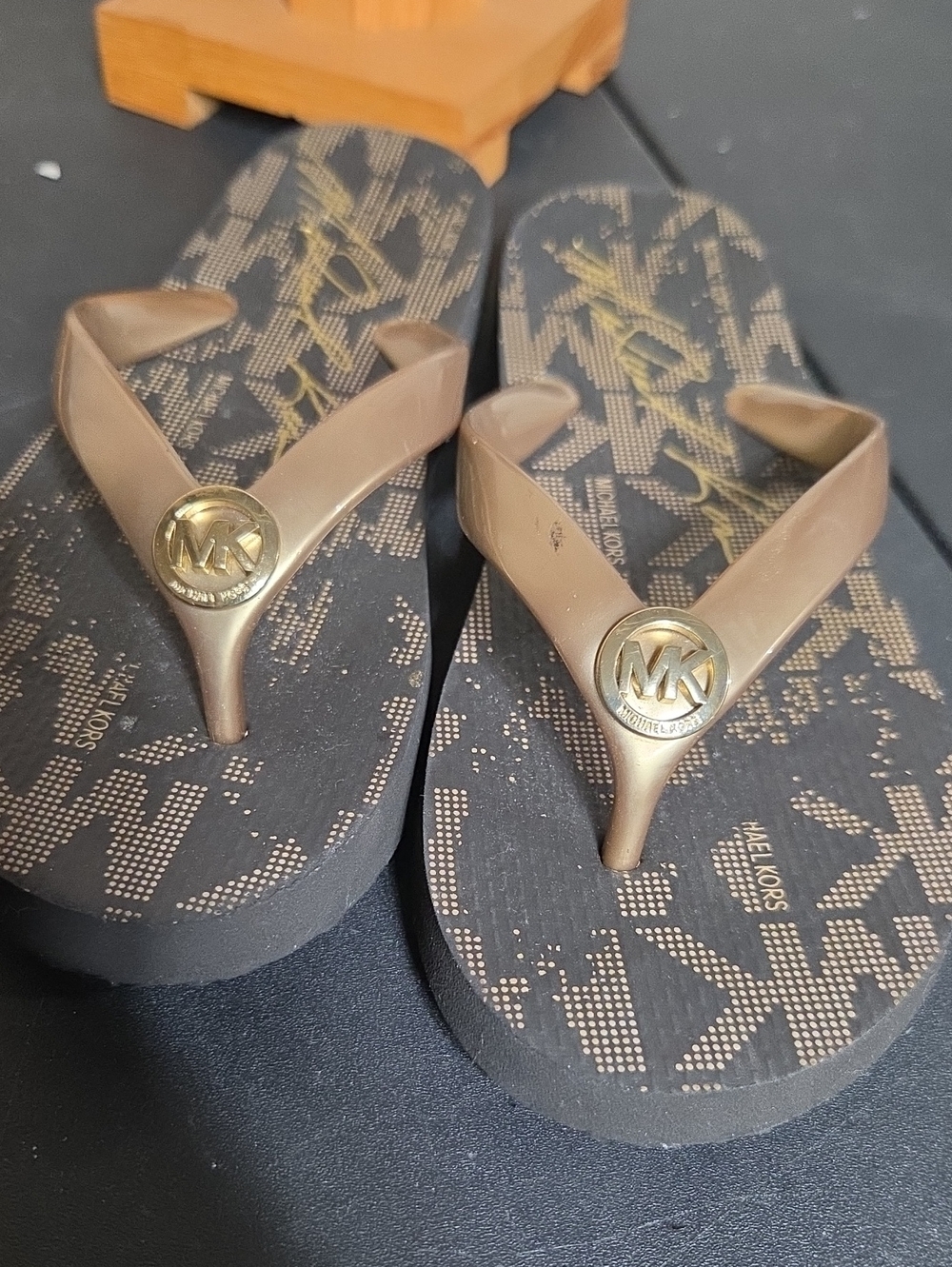 Michael Kors Brown Flip Flop Sandals with Gold MK Medallion